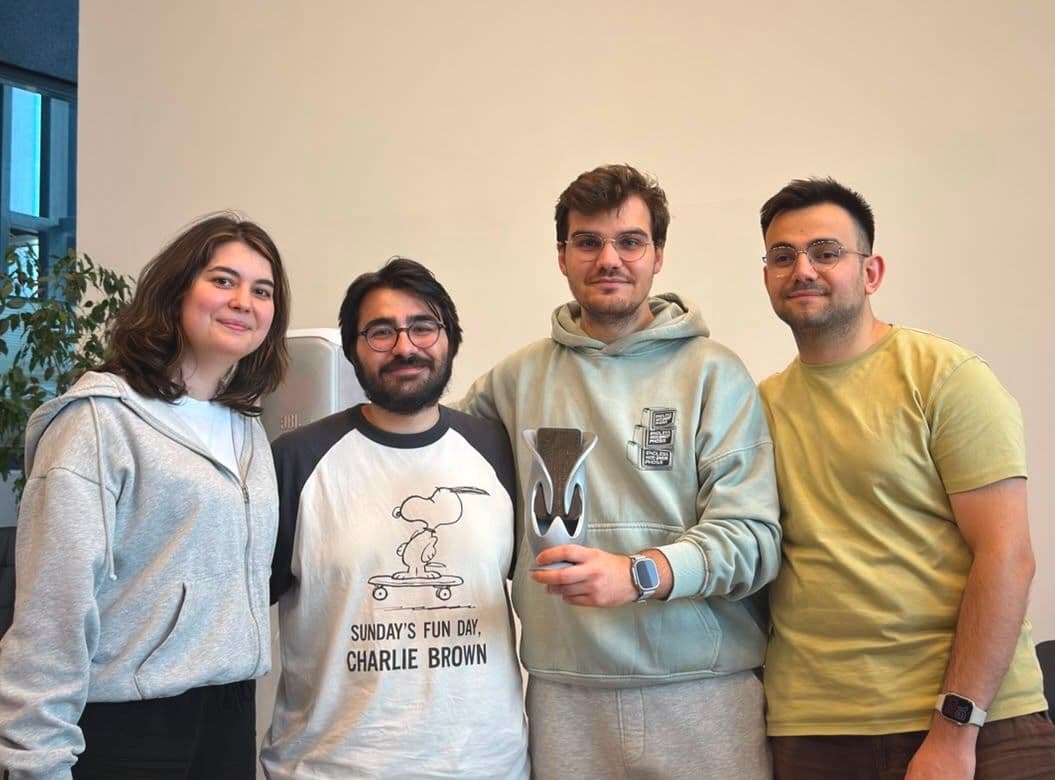 Mehmetcan Bozkuş and the Wraith Mobile Hackathon team holding the winner's trophy